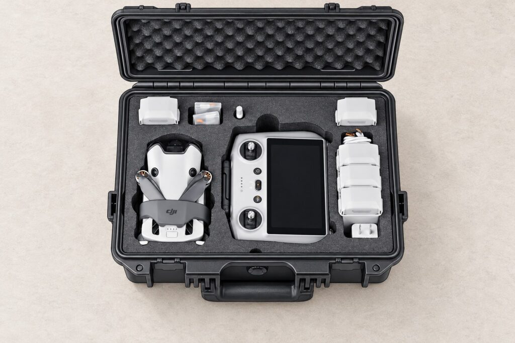 Illustration of a DJI Mini 4 Pro, RC 2 controller and batteries arranged in a Lykus MM410 hard case